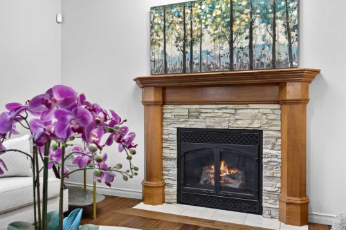 13 Cougar Ridge Circle Sw, Calgary, AB - Indoor Photo Showing Living Room With Fireplace