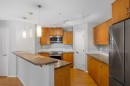2327-700 Willowbrook Road Nw, Airdrie, AB  - Indoor Photo Showing Kitchen With Stainless Steel Kitchen 