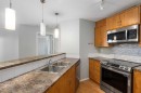 2327-700 Willowbrook Road Nw, Airdrie, AB  - Indoor Photo Showing Kitchen With Double Sink 