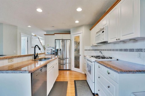 1650 Westmount Boulevard Nw, Calgary, AB - Indoor Photo Showing Kitchen With Double Sink With Upgraded Kitchen