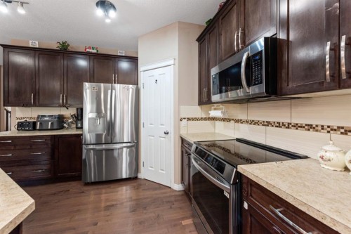 203 Morningside Circle Sw, Airdrie, AB - Indoor Photo Showing Kitchen With Stainless Steel Kitchen With Upgraded Kitchen
