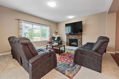 203 Morningside Circle Sw, Airdrie, AB - Indoor Photo Showing Living Room With Fireplace