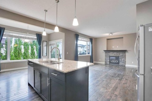 3 Sunset Court, Cochrane, AB - Indoor Photo Showing Kitchen With Double Sink With Upgraded Kitchen