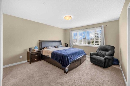 3 Sunset Court, Cochrane, AB - Indoor Photo Showing Bedroom
