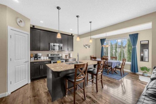 3 Sunset Court, Cochrane, AB - Indoor Photo Showing Kitchen With Upgraded Kitchen