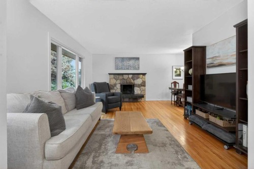 203 Southampton Drive Sw, Calgary, AB - Indoor Photo Showing Living Room With Fireplace