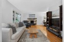 203 Southampton Drive Sw, Calgary, AB  - Indoor Photo Showing Living Room With Fireplace 