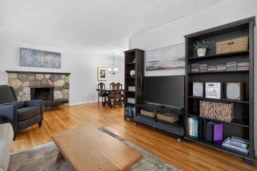 203 Southampton Drive Sw, Calgary, AB - Indoor Photo Showing Living Room With Fireplace