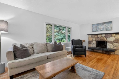 203 Southampton Drive Sw, Calgary, AB - Indoor Photo Showing Living Room With Fireplace