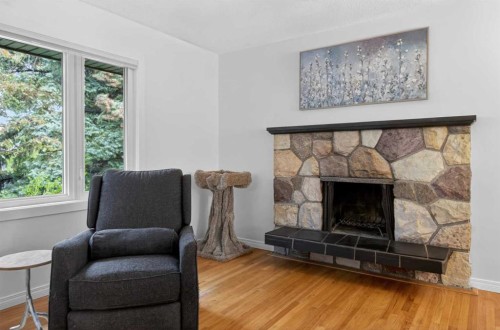 203 Southampton Drive Sw, Calgary, AB - Indoor Photo Showing Living Room With Fireplace