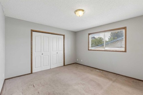 121 Quigley Drive, Cochrane, AB - Indoor Photo Showing Other Room