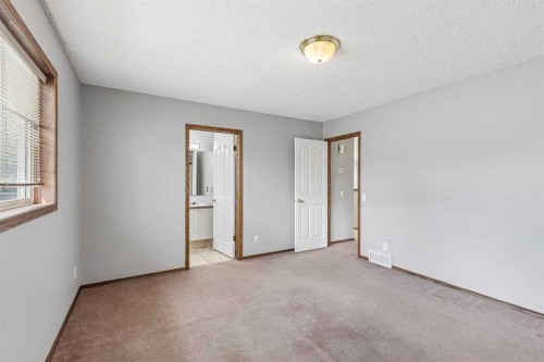 121 Quigley Drive, Cochrane, AB - Indoor Photo Showing Other Room
