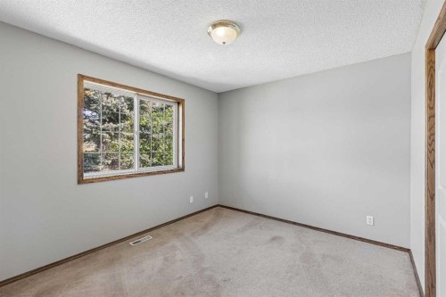 121 Quigley Drive, Cochrane, AB - Indoor Photo Showing Other Room