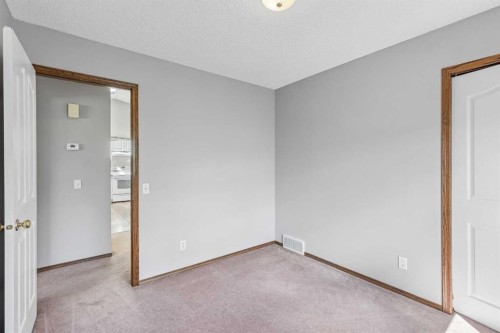 121 Quigley Drive, Cochrane, AB - Indoor Photo Showing Other Room