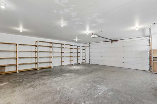 121 Quigley Drive, Cochrane, AB - Indoor Photo Showing Garage