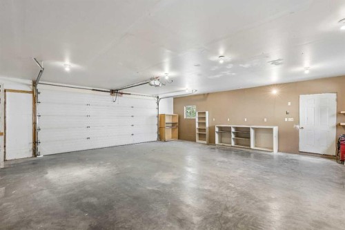 121 Quigley Drive, Cochrane, AB - Indoor Photo Showing Garage