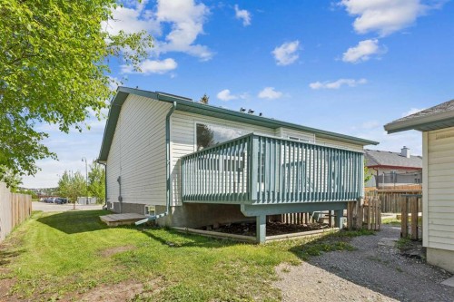 121 Quigley Drive, Cochrane, AB - Outdoor With Deck Patio Veranda With Exterior