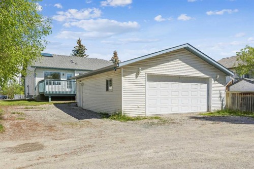 121 Quigley Drive, Cochrane, AB - Outdoor With Deck Patio Veranda