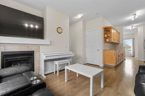 27 Bridleridge View Sw, Calgary, AB - Indoor Photo Showing Living Room With Fireplace