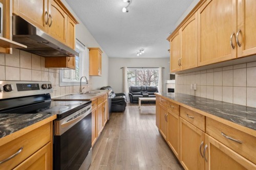 27 Bridleridge View Sw, Calgary, AB - Indoor Photo Showing Kitchen With Double Sink