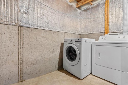 27 Bridleridge View Sw, Calgary, AB - Indoor Photo Showing Laundry Room