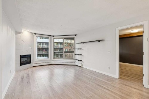 304-317 19 Avenue Sw, Calgary, AB - Indoor With Fireplace