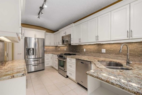 35 Prominence Path Sw, Calgary, AB - Indoor Photo Showing Kitchen With Double Sink With Upgraded Kitchen