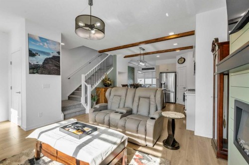 7 Emberside Park, Cochrane, AB - Indoor Photo Showing Living Room With Fireplace