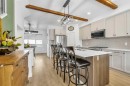 7 Emberside Park, Cochrane, AB  - Indoor Photo Showing Kitchen With Upgraded Kitchen 