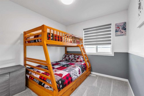 7 Emberside Park, Cochrane, AB - Indoor Photo Showing Bedroom