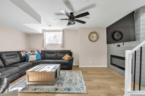 7 Emberside Park, Cochrane, AB - Indoor Photo Showing Living Room With Fireplace