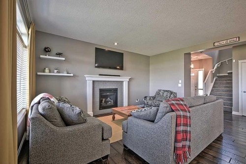 732 Hampton Hills Drive Ne, High River, AB - Indoor Photo Showing Living Room With Fireplace