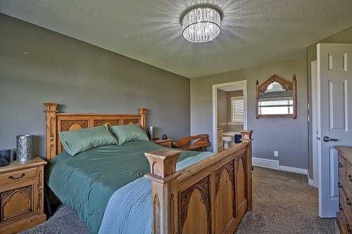 732 Hampton Hills Drive Ne, High River, AB - Indoor Photo Showing Bedroom