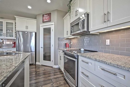 732 Hampton Hills Drive Ne, High River, AB - Indoor Photo Showing Kitchen With Stainless Steel Kitchen With Double Sink With Upgraded Kitchen