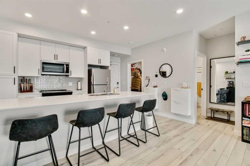 208-255 Les Jardins Park Se, Calgary, AB - Indoor Photo Showing Kitchen With Upgraded Kitchen