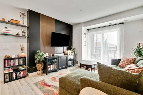 208-255 Les Jardins Park Se, Calgary, AB - Indoor Photo Showing Living Room