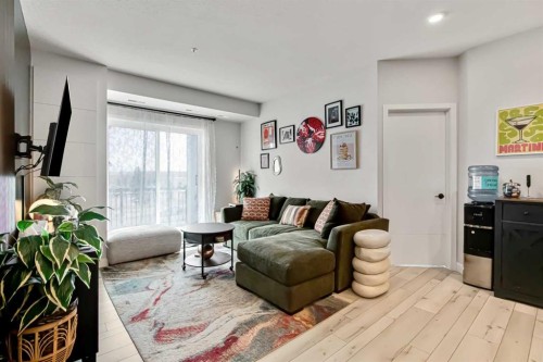 208-255 Les Jardins Park Se, Calgary, AB - Indoor Photo Showing Living Room