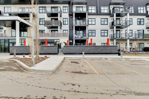 208-255 Les Jardins Park Se, Calgary, AB - Outdoor With Balcony With Facade