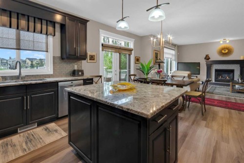 172 Ridge View Close, Cochrane, AB - Indoor Photo Showing Kitchen With Fireplace
