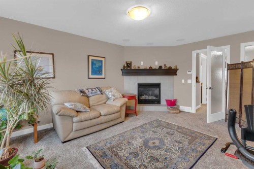 172 Ridge View Close, Cochrane, AB - Indoor Photo Showing Living Room With Fireplace