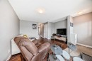 49 Aspen Hills Drive Sw, Calgary, AB  - Indoor Photo Showing Living Room 