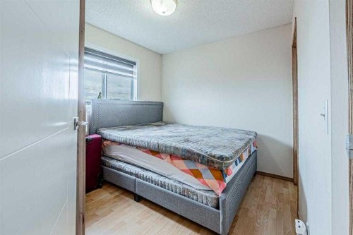 65 Martinvalley Road Ne, Calgary, AB - Indoor Photo Showing Bedroom