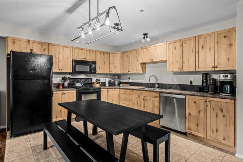 111-300 Palliser, Canmore, AB - Indoor Photo Showing Kitchen
