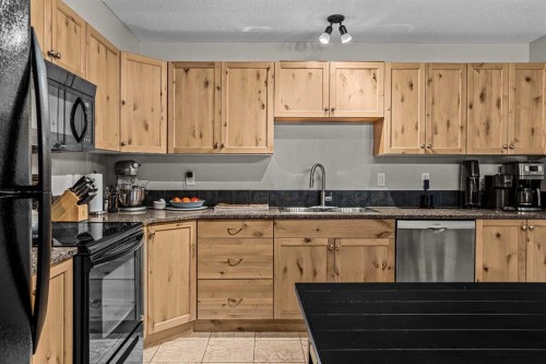 111-300 Palliser, Canmore, AB - Indoor Photo Showing Kitchen