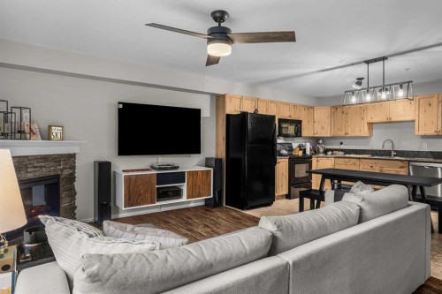 111-300 Palliser, Canmore, AB - Indoor With Fireplace