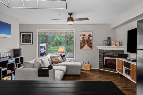 111-300 Palliser, Canmore, AB - Indoor Photo Showing Living Room With Fireplace
