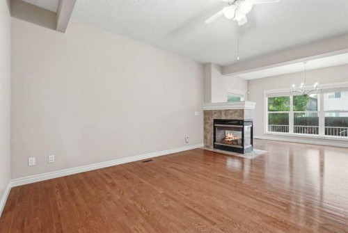 378 Chaparral Ridge Circle Se, Calgary, AB - Indoor Photo Showing Other Room With Fireplace