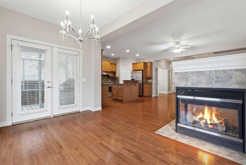 378 Chaparral Ridge Circle Se, Calgary, AB - Indoor Photo Showing Living Room With Fireplace