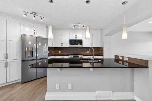 108 Auburn Crest Park Se, Calgary, AB - Indoor Photo Showing Kitchen With Upgraded Kitchen