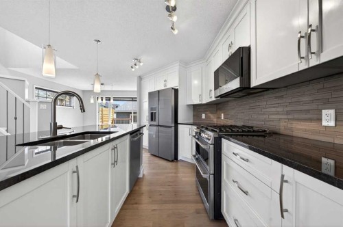 108 Auburn Crest Park Se, Calgary, AB - Indoor Photo Showing Kitchen With Stainless Steel Kitchen With Double Sink With Upgraded Kitchen
